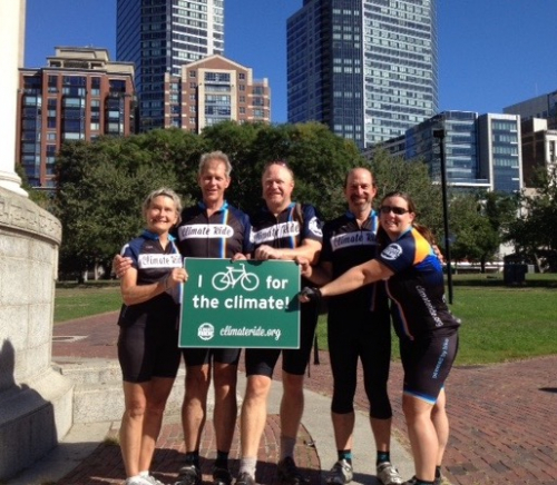 Mary Selkirk and friends holding a Climate Ride bike sign